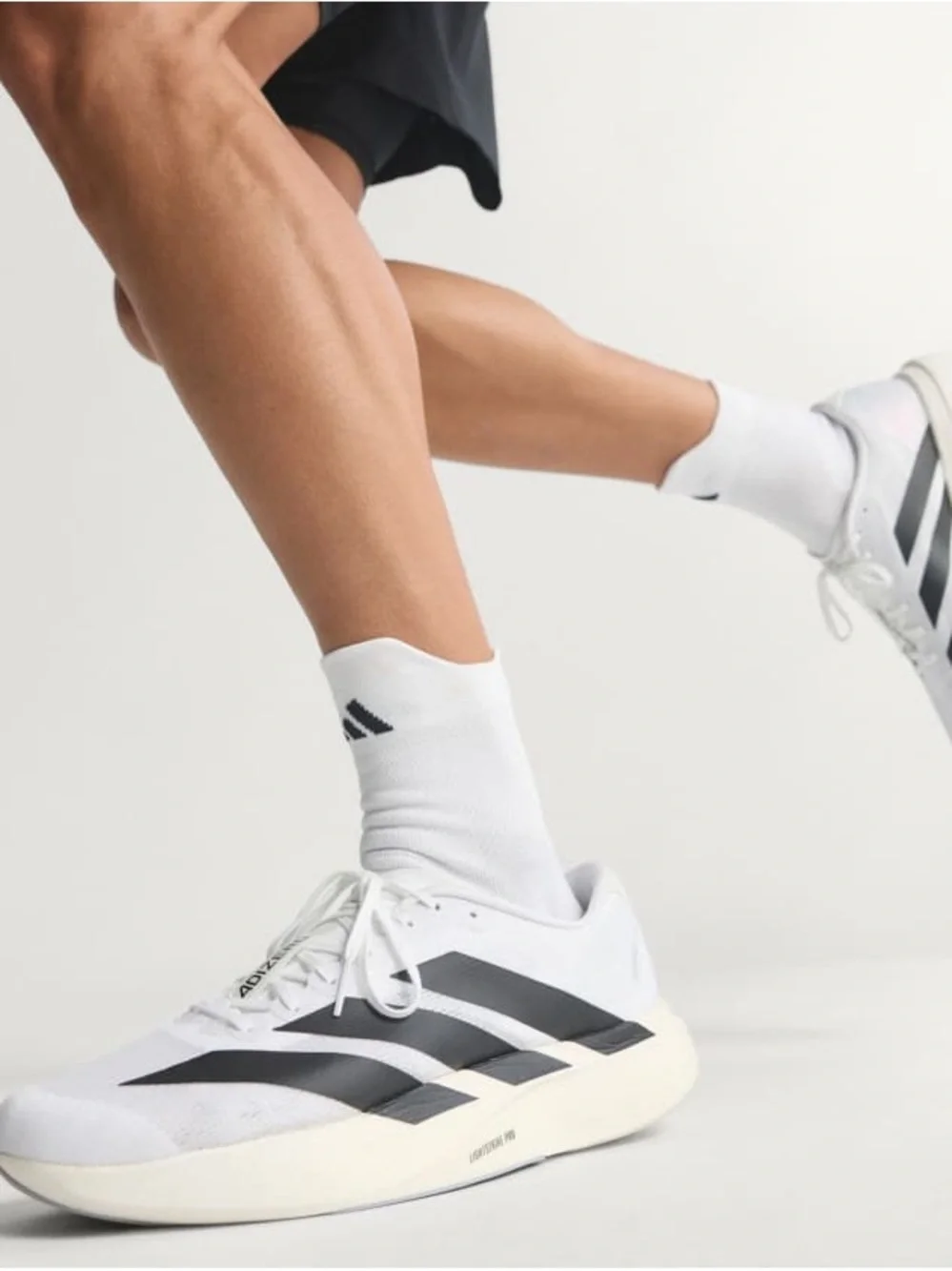 Brand New adidas Adizero Evo SL running shoes in Cloud White and Core Black.